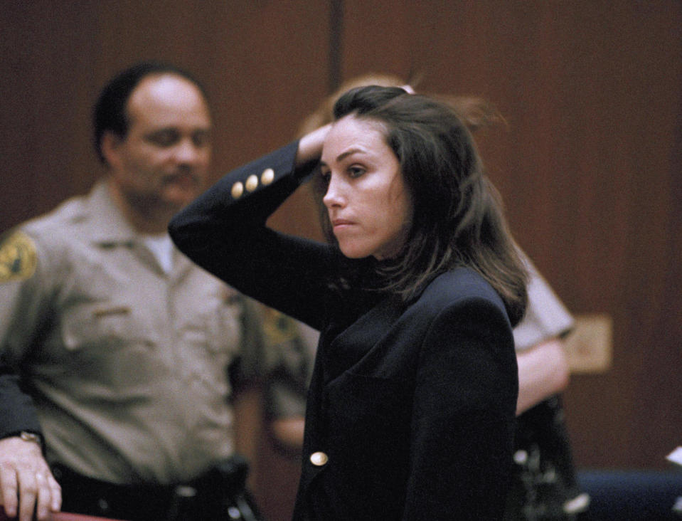 Reputed "Hollywood Madam," Heidi Fleiss brushes back her hair as she listens to her attorneys ask Superior Court Judge Judith Champagne to determine if jurors in her case violated their deliberations by improperly discussing the case outside the jury room, Jan. 30, 1995, in Los Angeles. Fleiss remains free on bail. (AP Photo/Chris Martinez)