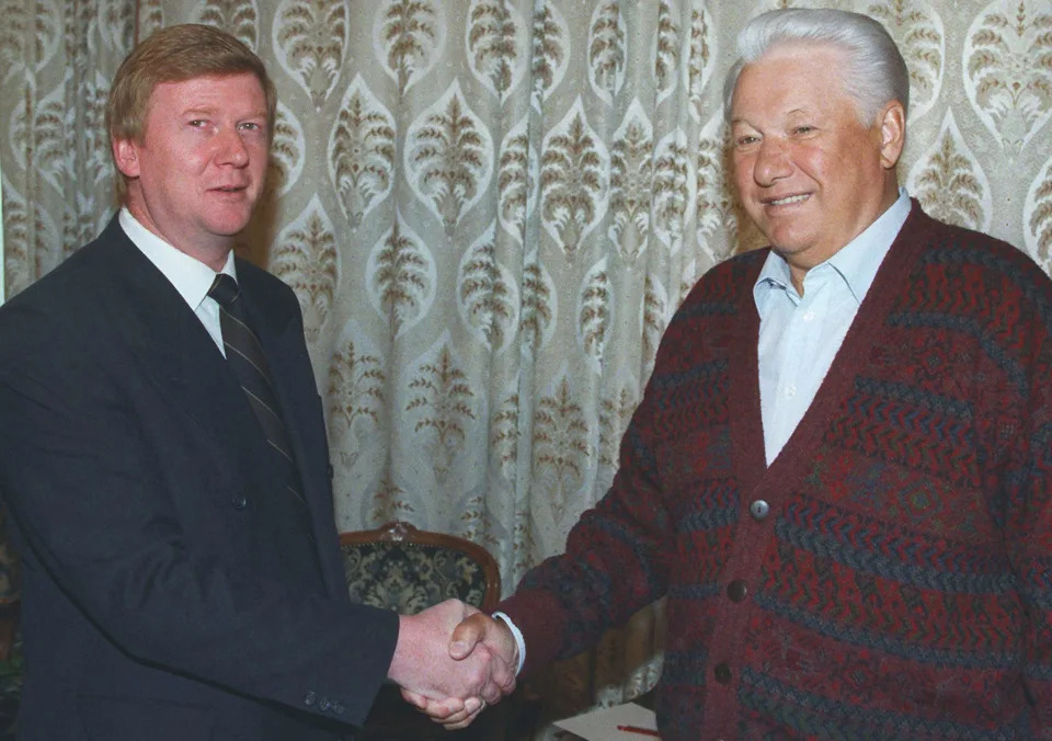 FILE - Russian President Boris Yeltsin smiles as he shakes hands with his Chief of Staff Anatoly Chubais, in Moscow's Central Kremlin Hospital, Sept. 18, 1996. Chubais, who was President Vladimir Putin's envoy to international organizations on sustainable development, is well known in Russia. He held high profile posts for nearly three decades, beginning under Yeltsin, the first post-Soviet leader. On Wednesday, March, 23, 2022, the Kremlin confirmed media reports about the resignation of Chubais. (AP Photo/Pool, File)