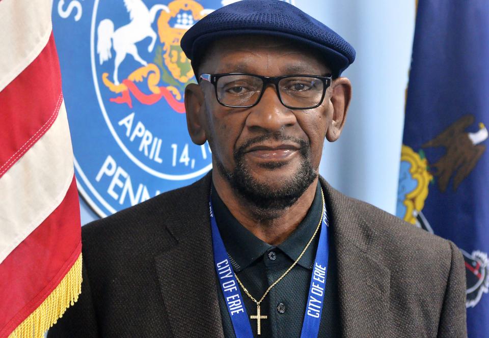 Daryl Craig, community liaison for the city of Erie, stands in front of the city's seal near his office on the fifth floor of Erie City Hall.