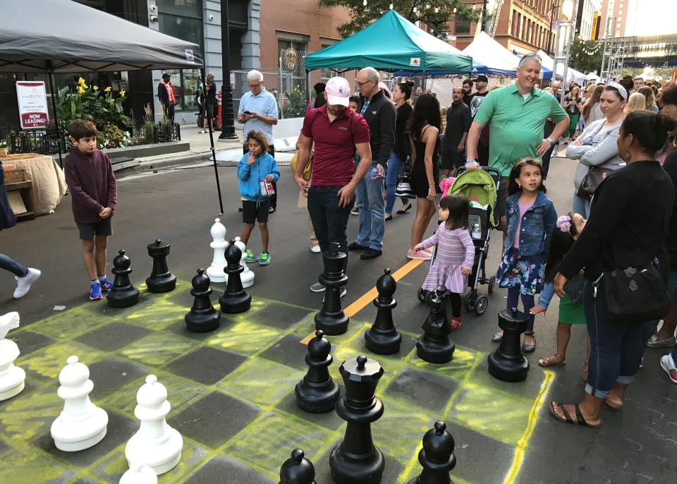 An oversize chess board was one of the attractions at the NEWaukee Night Market on Aug. 14, 2019. The market has been renamed the Milwaukee Night Market since Westown Association took over market leadership in 2021.