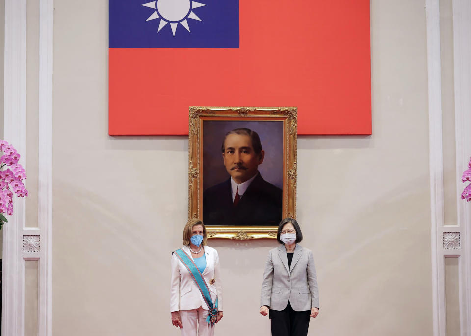 In this photo released by the Taiwan Presidential Office, U.S. House Speaker Nancy Pelosi, left, and Taiwanese President President Tsai Ing-wen stand during a meeting in Taipei, Taiwan, Wednesday, Aug. 3, 2022. U.S. House Speaker Nancy Pelosi, meeting top officials in Taiwan despite warnings from China, said Wednesday that she and other congressional leaders in a visiting delegation are showing they will not abandon their commitment to the self-governing island. (Taiwan Presidential Office via AP)