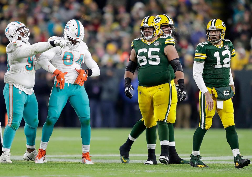 Miami Dolphins defensive end Robert Quinn celebrates after sacking Green Bay Packers quarterback Aaron Rodgers during their football game on Nov. 11, 2018, at Lambeau Field in Green Bay