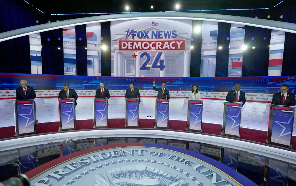 (From left) Republican presidential candidate former Arkansas Gov. Asa Hutchinson, Republican presidential candidate former New Jersey governor Chris Christie, Republican presidential candidate former Vice President Mike Pence, Republican presidential candidate former Vice President Mike Pence, Republican presidential candidate Florida governor Ron DeSantis, Republican presidential candidate Biotech entrepreneur Vivek Ramaswamy, Republican presidential candidate former former U.N. Ambassador Nikki Haley, Republican presidential candidate South Carolina Republican U.S. Sen. Tim Scott, and Republican presidential candidate North Dakota governor Doug Burgum are itake the podiums at Fiserv Forum during the first 2023 Republican presidential debate in Milwaukee on Wednesday, Aug. 23, 2023. - Mike De Sisti / The Milwaukee Journal Sentinel