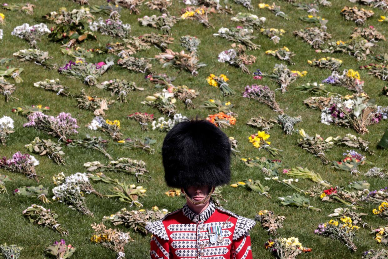 A soldier stands outside the Windsor Castle ahead of the funeral of Britain's Prince Philip in Windsor, England, Saturday, April 17, 2021.