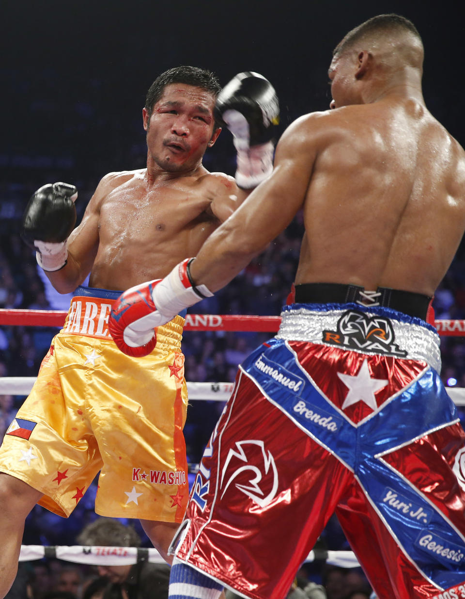 Yuriorkis Gamboa, from Miami, Fla., right, and Michael Farenas, from the Philippines, trade blows during their WBA interim super featherweight title fight Saturday, Dec. 8, 2012, in Las Vegas. (AP Photo/Eric Jamison)