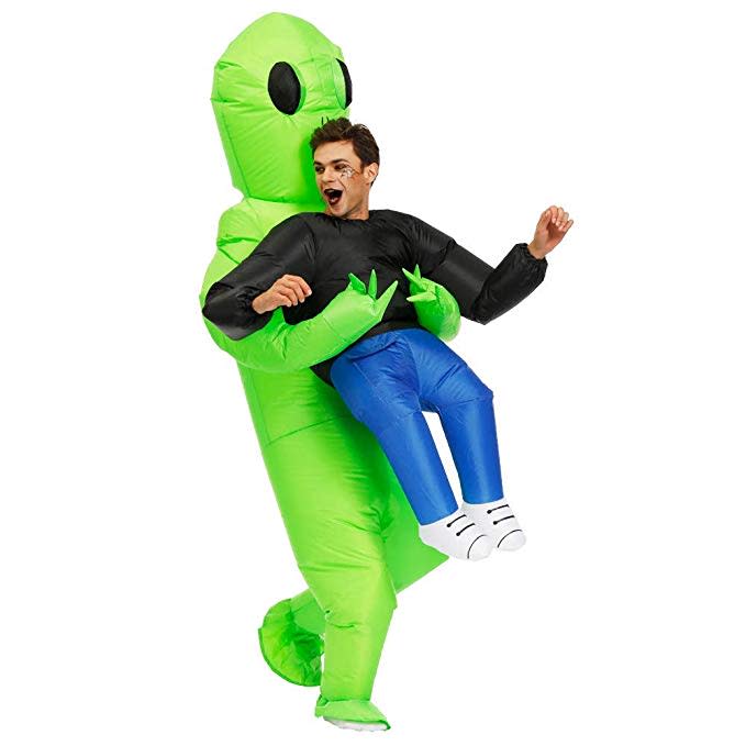 inflatable alien costume holding a man