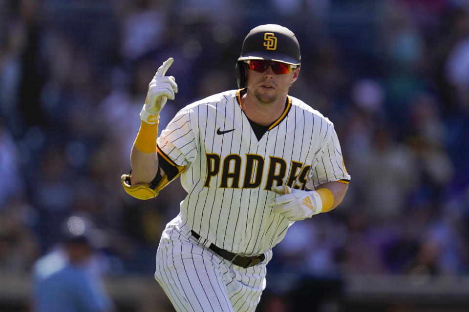 San Diego Padres' Jake Cronenworth celebrates after hitting a two-run home run during the sixth inning of the first baseball game of a doubleheader against the Colorado Rockies, Tuesday, Aug. 2, 2022, in San Diego. (AP Photo/Gregory Bull)