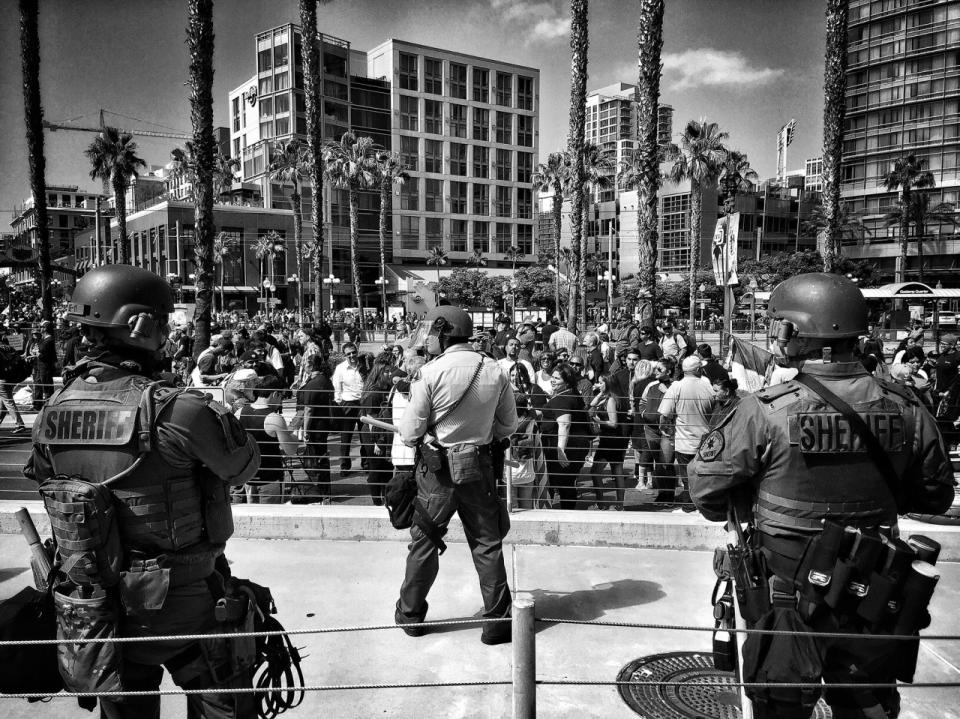 <p>San Diego law enforcement in riot gear stand off with protesters outside a Trump rally on May 27 in San Diego, Calif. (Photo: Holly Bailey/Yahoo News) </p>