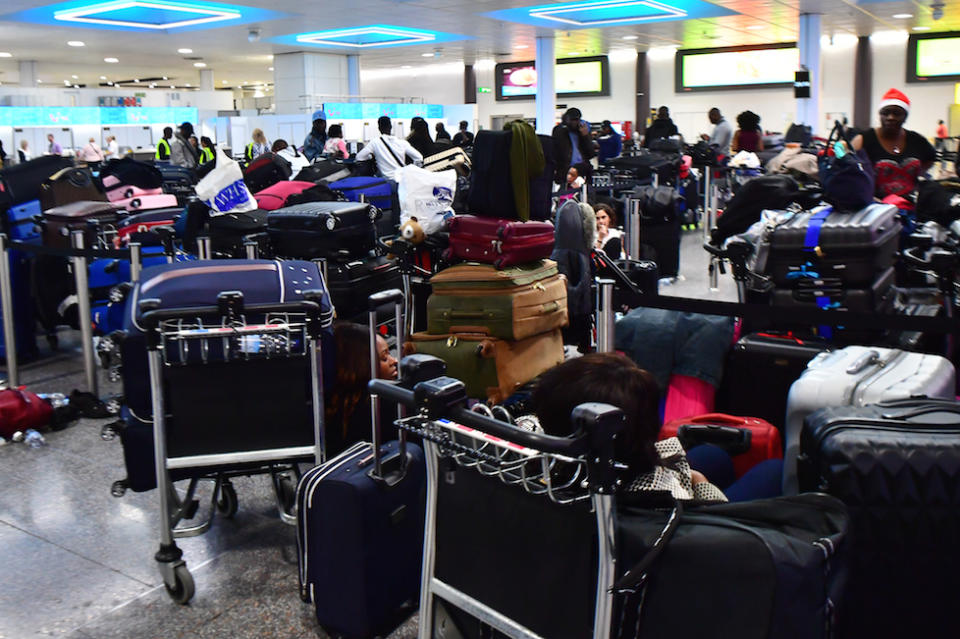 Passengers stranded at Gatwick Airport during December’s travel disruption (Picture: PA)