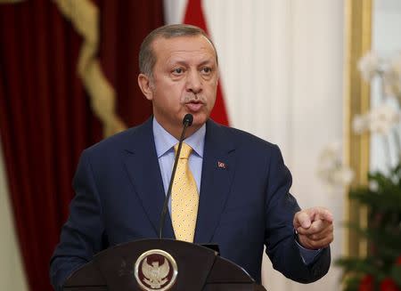 Turkey's President Recep Tayyip Erdogan speaks at a joint media briefing with Indonesia's President Joko Widodo at the presidential palace in Jakarta, Indonesia July 31, 2015. REUTERS/Darren Whiteside