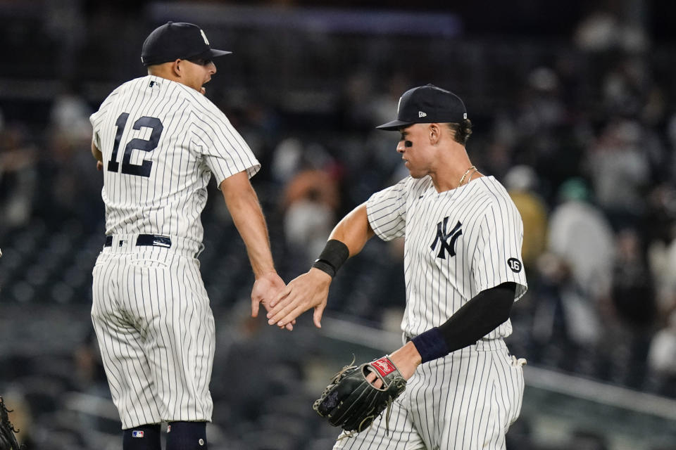 New York Yankees' Rougned Odor, left, celebrates with Aaron Judge after a baseball game against the Texas Rangers, Monday, Sept. 20, 2021, in New York. (AP Photo/Frank Franklin II)