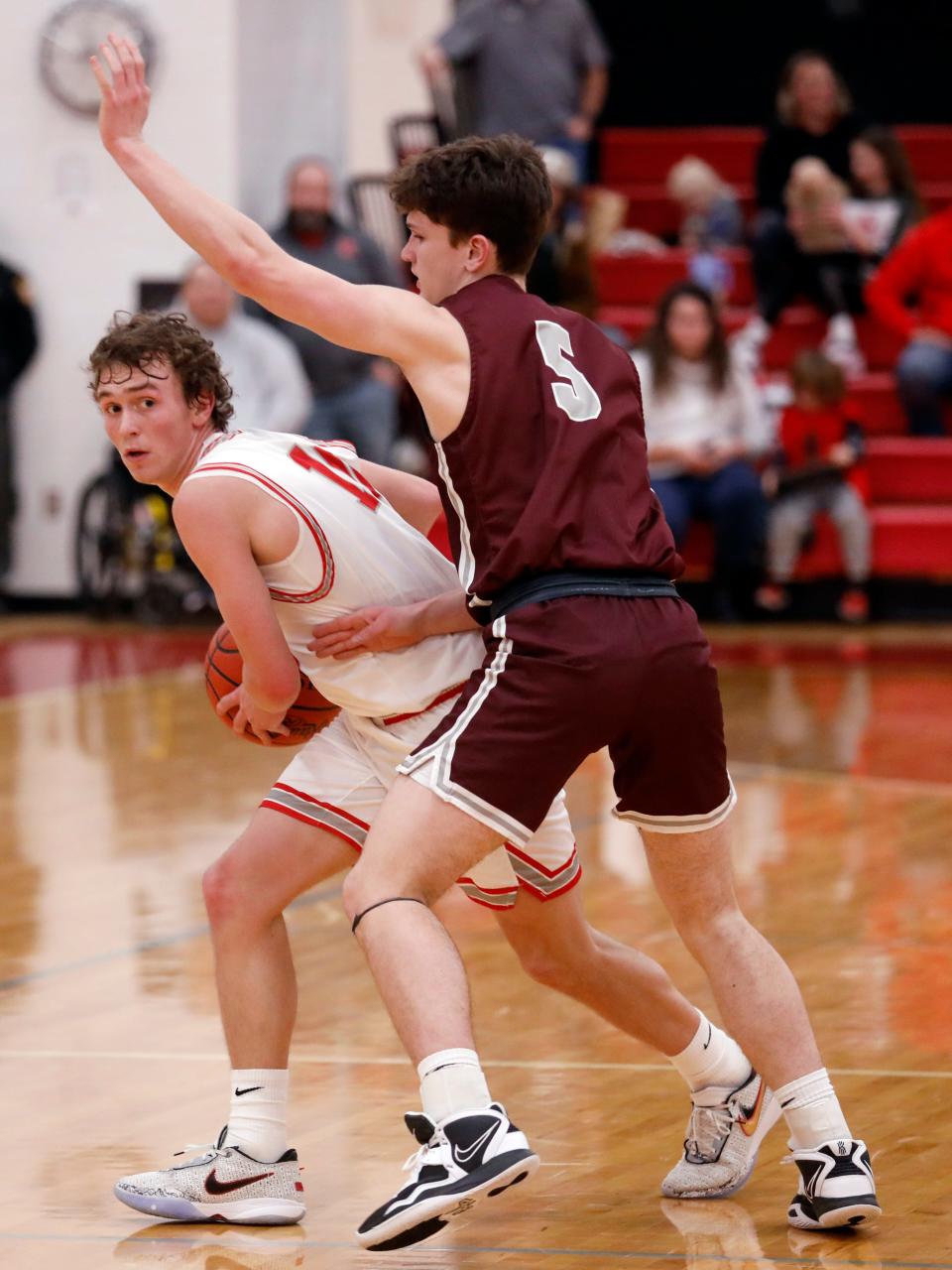Sheridan's Reed Coconis, left, is guarded by John Glenn's Noah Winland in a regular season game. Coconis made the Southeast District First Team, selected by media within the district.