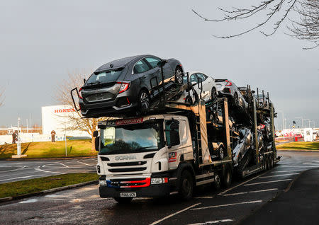 A lorry with car carrier trailer leaves the Honda car plant in Swindon, Britain, February 18, 2019. REUTERS/Eddie Keogh