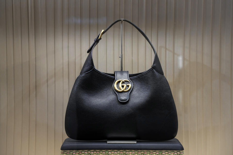 File - A handbag is displayed in the window of a Gucci store in Pittsburgh on Monday, Jan. 30, 2023. On Friday, the Commerce Department issues its February report on consumer spending. (AP Photo/Gene J. Puskar, File)