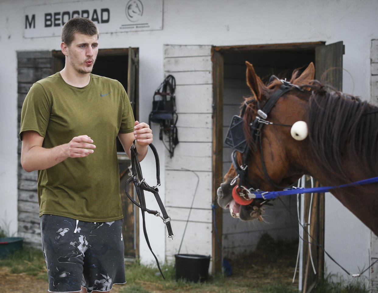 BELGRADE, SERBIA - JUNE 23: Serbian professional basketball player Nikola Jokic of the Denver Nuggets leads his horse to the stable area after the race at Beogradski hipodrom on June 23, 2019 in Belgrade, Serbia. (Photo by Srdjan Stevanovic/Getty Images)