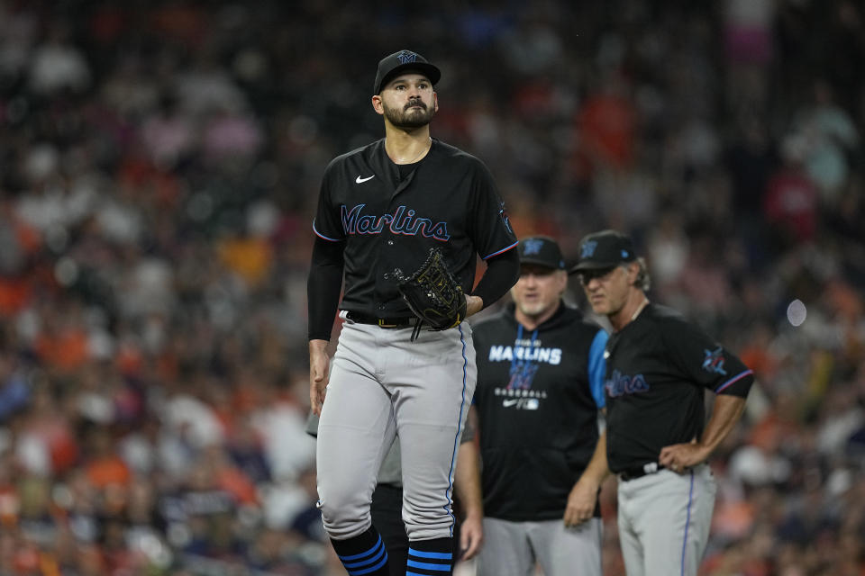 Miami Marlins starting pitcher Pablo Lopez walks back to mound after being hit by a ball off the bat of Houston Astros' Michael Brantley during the fifth inning of a baseball game Friday, June 10, 2022, in Houston. (AP Photo/David J. Phillip)