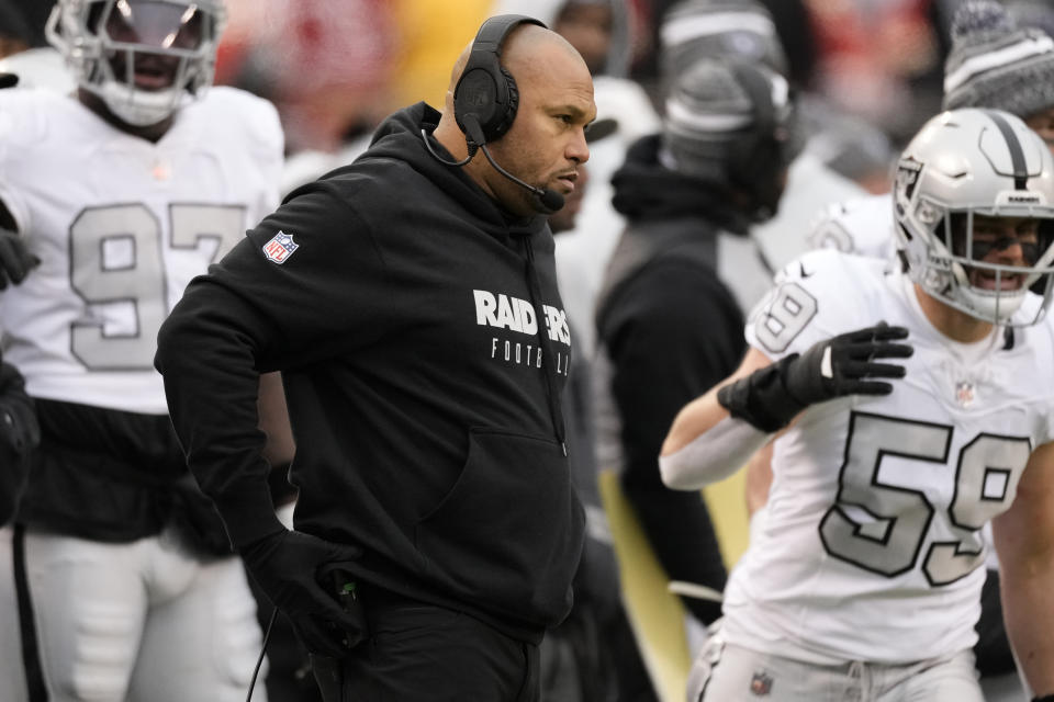 Las Vegas Raiders interim head coach Antonio Pierce watches from the sidelines during the first half of an NFL football game against the Kansas City Chiefs Monday, Dec. 25, 2023, in Kansas City, Mo. (AP Photo/Charlie Riedel)