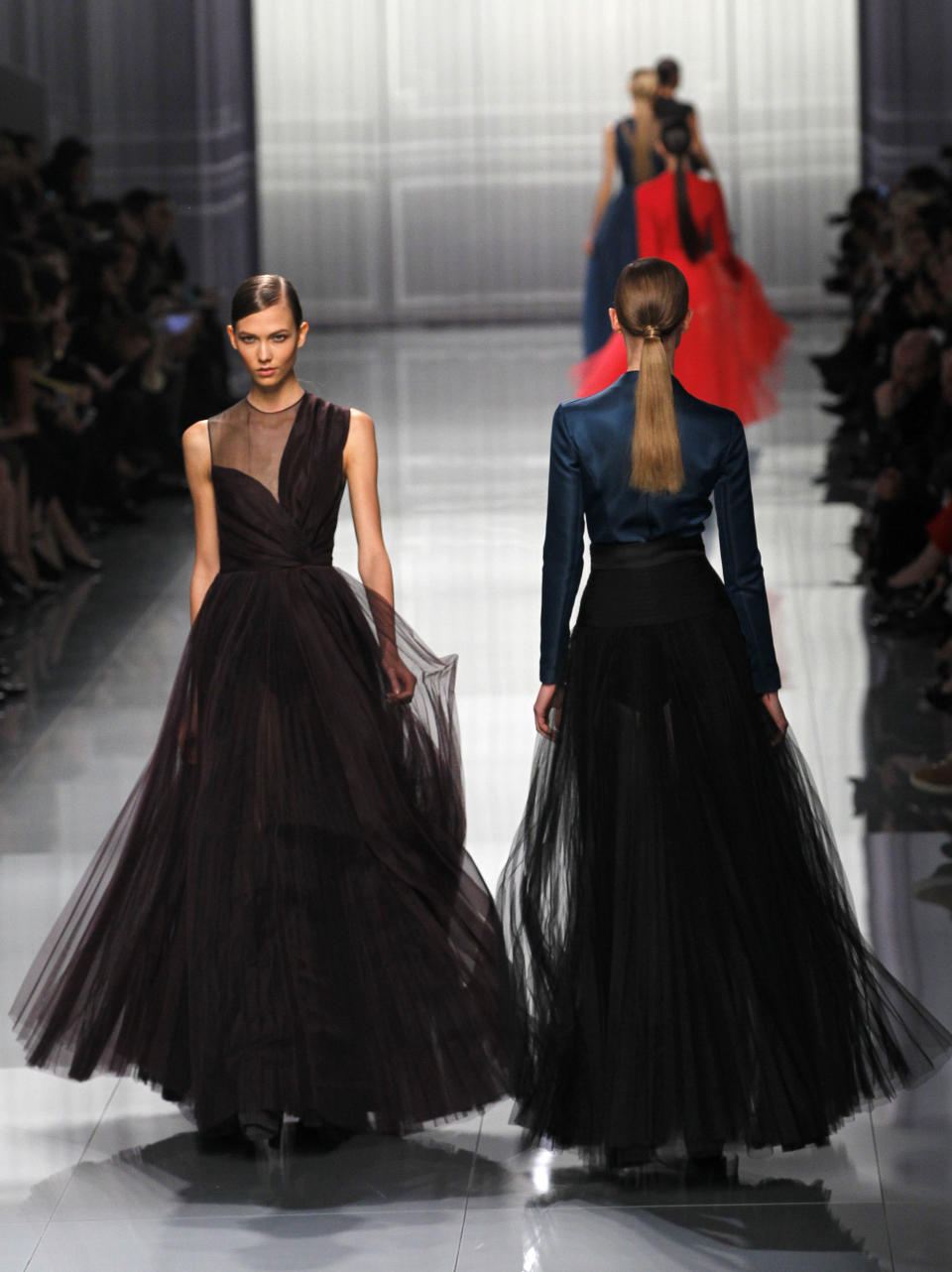 Models wear creations from designer Christian Dior as part of the Fall-Winter, ready-to-wear 2013 fashion collection, during Paris Fashion week, Friday, March 2, 2012. (AP Photo/Christophe Ena)