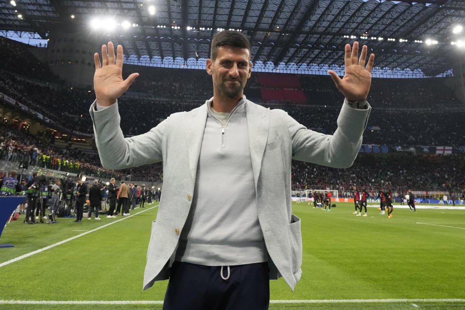 Serbian tennis star Novak Djokovic poses for photograph prior to the start of the Champions League semifinal first leg soccer match between AC Milan and Inter Milan at the San Siro stadium in Milan, Italy, Wednesday, May 10, 2023. (AP Photo/Antonio Calanni)