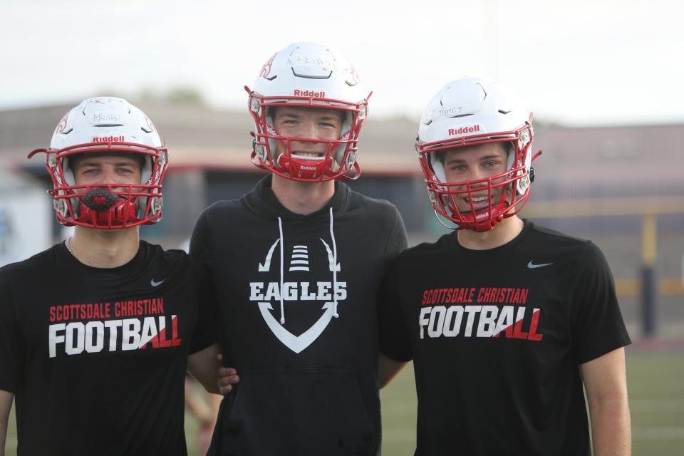 From left to right: WR Andrew Trapp, QB Jack Atkinson and RB Jacob Trapp pose for a photo on the Scottsdale Christian High School football field in Paradise Valley on July 24, 2023.