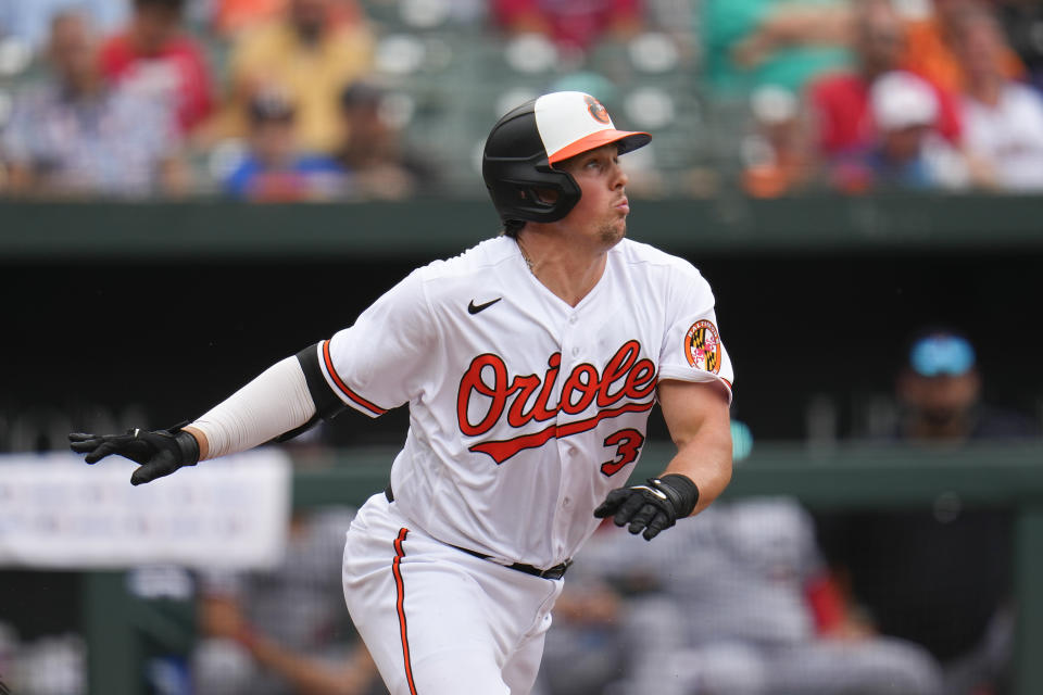 Baltimore Orioles' Adley Rutschman runs out of the box while hitting an infield single against the Minnesota Twins in the eighth inning of a baseball game, Sunday, July 2, 2023, in Baltimore. The Orioles won 2-1. (AP Photo/Julio Cortez)