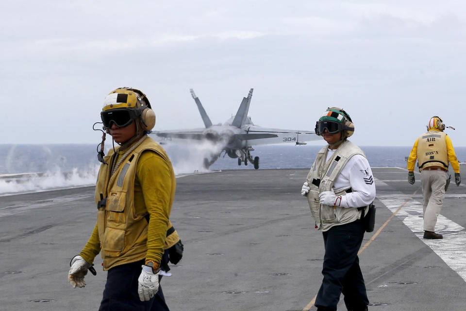 A U.S. fighter jet takes off from the U.S. aircraft carrier USS Ronald Reagan for their patrol at the international waters off South China Sea Tuesday, Aug. 6, 2019. The U.S. aircraft carrier has sailed through the disputed South China Sea in the latest show of America's military might amid new territorial flareups involving China and three rival claimant states as Philippines, Vietnam and Malaysia. (AP Photo/Bullit Marquez)