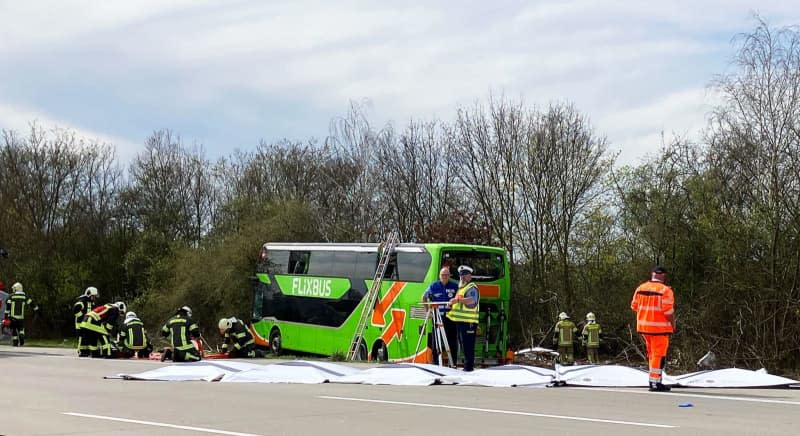 Police and fire department work at the accident scene on the A9. At least five people died and several were injured in an accident involving a coach on the A9 near Leipzig. Birgit Zimmermann/dpa