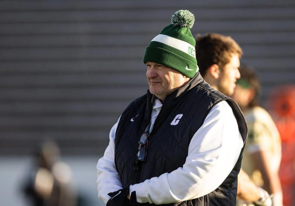 UNC Charlotte coach Biff Poggi coaches during his first practice at the Jerry Richardson Stadium in Charlotte, N.C., on Tuesday, March 21, 2023.