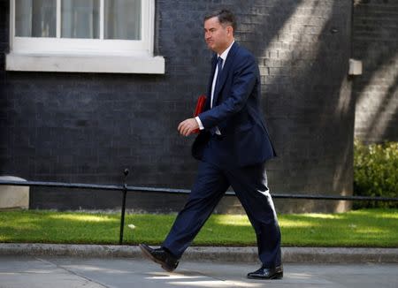 FILE PHOTO: David Gauke, Secretary of State for Work and Pensions arrives in Downing Street for a cabinet meeting, in central London, Britain June 13, 2017. REUTERS/Phil Noble