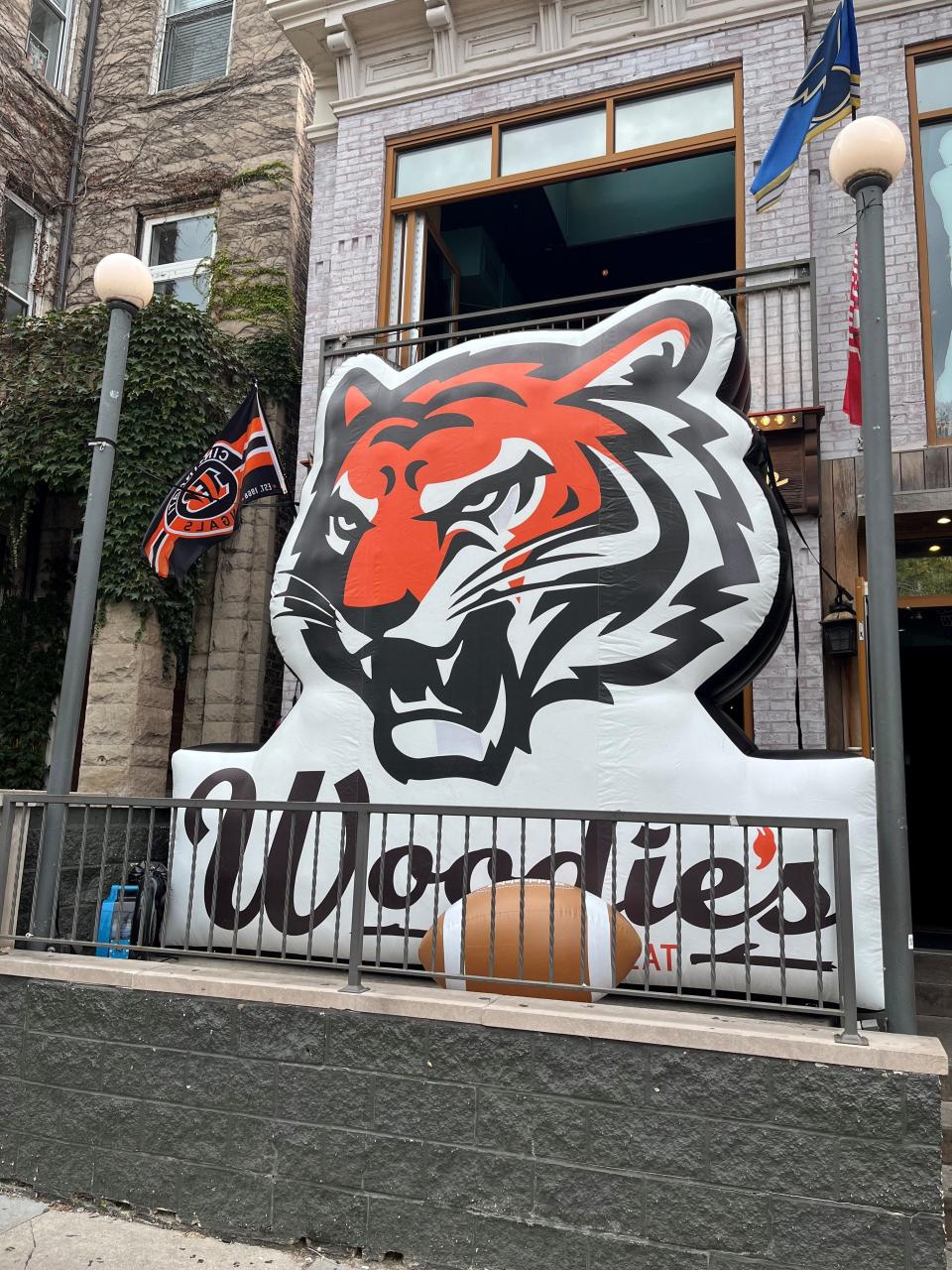 This sign welcomes patrons to Woodie’s Flat, a bar for displaced Bengals fans.