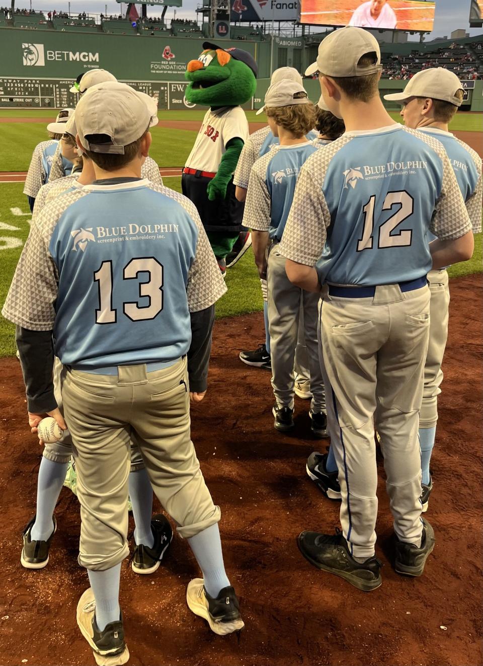 The Exeter Cal Ripken team of 12-and-under baseball players made an appearance on the field at Fenway Park in Boston, shaking hands with Red Sox players, Wednesday, April 17, 2024.