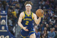 Golden State Warriors guard Brandin Podziemski runs downcourt during the first half of an NBA basketball game against the Utah Jazz, Sunday, April 7, 2024, in San Francisco. (AP Photo/Nic Coury)