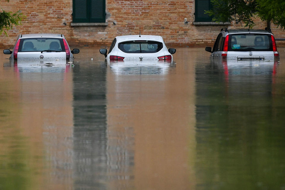 Flooded cars are pictured on a street in Cesena on May 17.<span class="copyright">Alessandro Serrano—AFP/Getty Images</span>