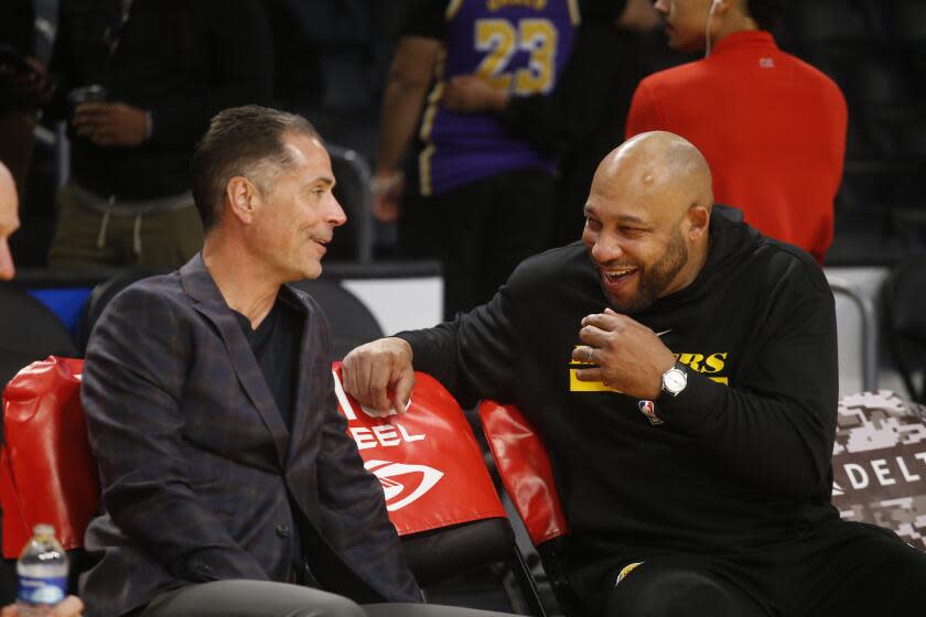 FILE - Los Angeles Lakers coach Darvin Ham, right, talks with general manager Rob Pelinka.