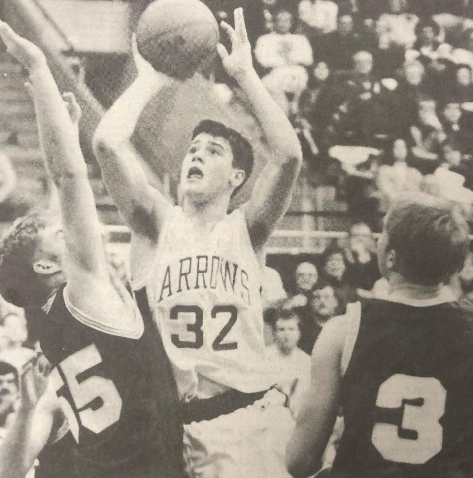 Watertown's Brian Norberg (32) shoots against Sioux Falls Roosevelt's Ryan Carlson and Aaron Hammrich (3) during their 1993 high school boys basketball game in the Watertown Civic Arena.