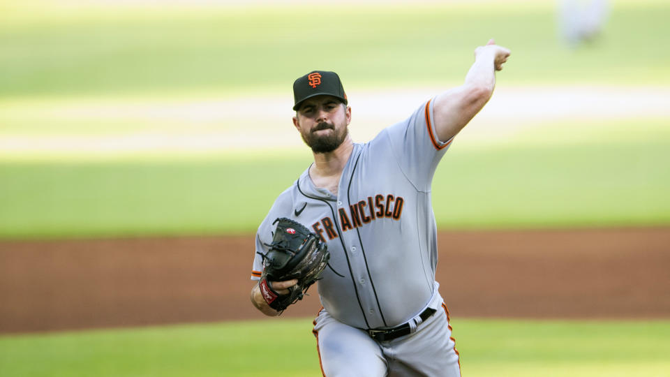 San Francisco Giants starting pitcher Carlos Rodon throws in the first inning of a baseball game against the Atlanta Braves Wednesday, June 22, 2022, in Atlanta. (AP Photo/Hakim Wright Sr.)