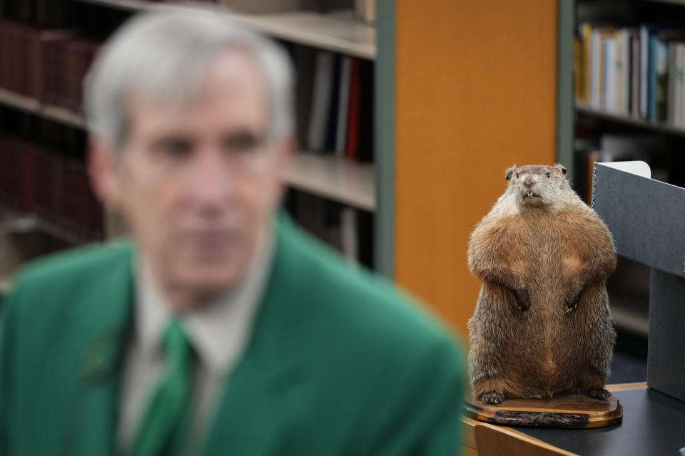 Kutztown University anthropology professor William W. Donner speaks in view of the taxidermy mascot of Groundhog Lodge Number 1 during an interview in Kutztown, Pa., Monday, Jan. 29, 2024. These lodges began as a way to preserve and celebrate Pennsylvania Dutch culture and traditions. (AP Photo/Matt Rourke)