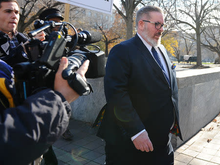 Robert Driscoll, an attorney for Maria Butina, who is accused of acting as a Russian agent to infiltrate the National Rifle Association lobby group and influence U.S. policy toward Moscow, leaves U.S. District Court after his client's plea hearing in Washington, U.S., December 13, 2018. REUTERS/Mary F. Calvert