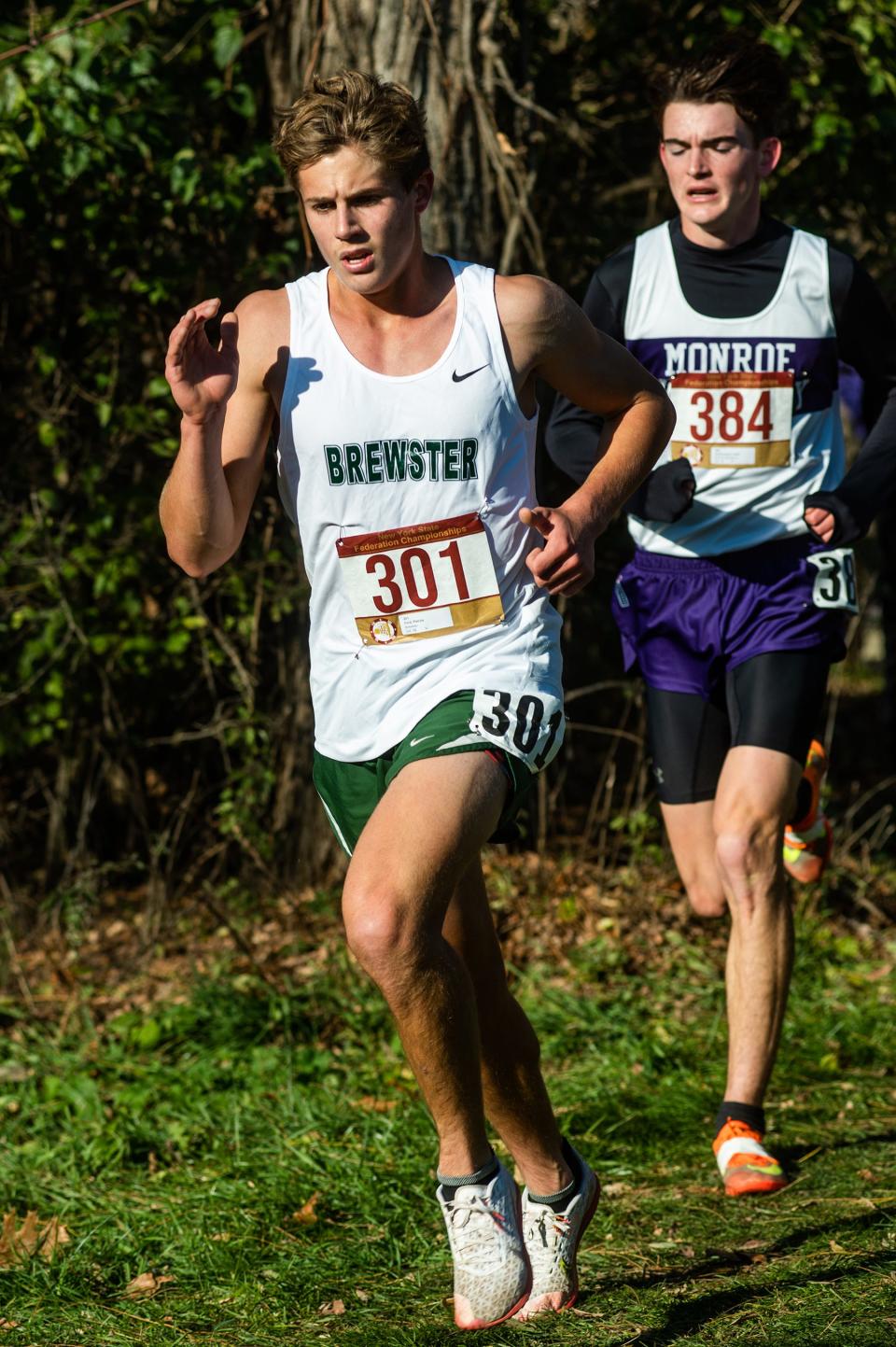 Brewster's Pat Ford runs the course, with Monroe-Woodbury's Collin Catherwood in tow during the state Federation championships at Bowdoin Park in Poughkeepsie on Saturday, November 19, 2022.