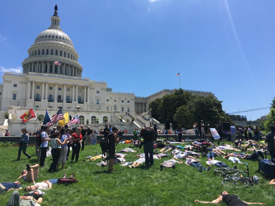 Demonstrators take part in&nbsp;a National Die-In&nbsp;demonstration in Washington on June 12, lying quietly for 720 seconds &mdash; one for each mass shootings in the U.S. since the Pulse nightclub attack in Orlando, Florida, two years ago. (Photo: Nick Wing)