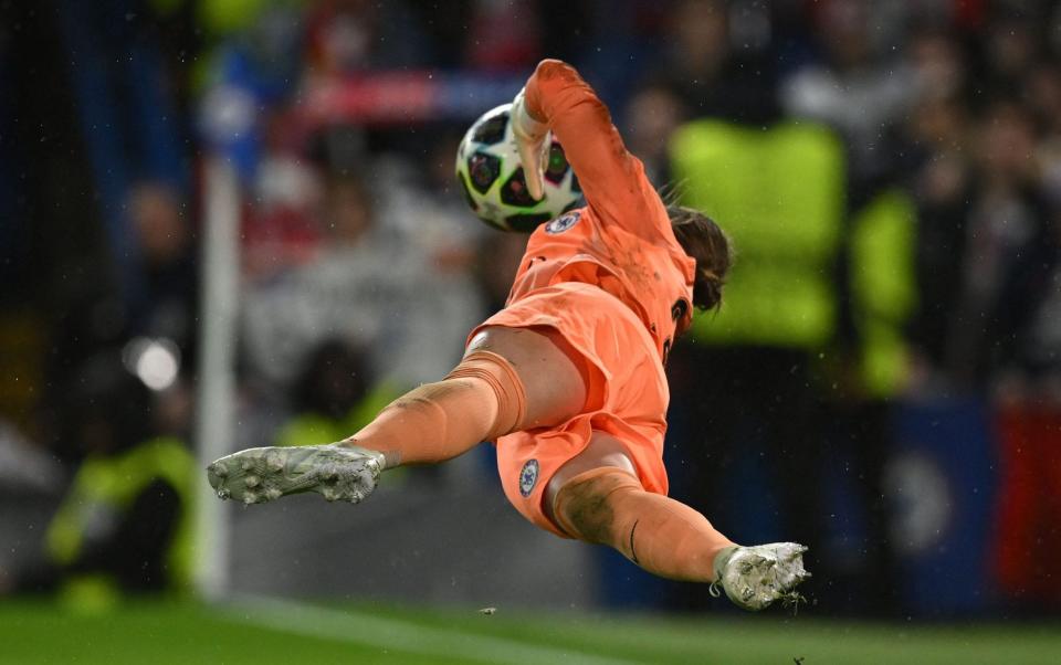 Chelsea's German goalkeeper Ann-Katrin Berger saves the vital penalty from Lyon's US midfielder Lindsey Horan in the shoot-out during the UEFA Women's Champions League quarter-final second leg football match between Chelsea and Lyon at Stamford Bridge - JUSTIN TALLIS/AFP via Getty Images