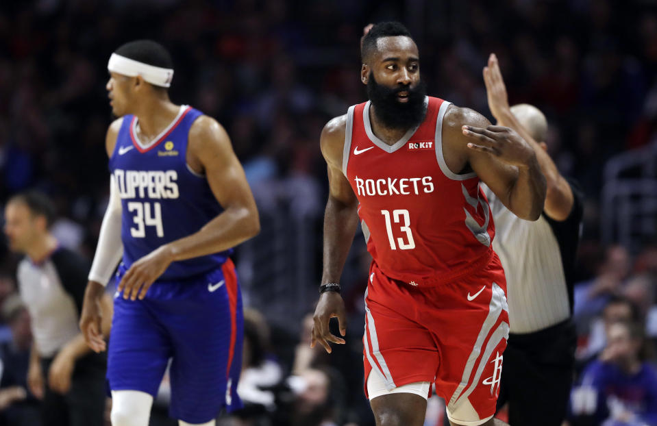 Houston Rockets' James Harden (13) gestures after making a 3-point basket against the Los Angeles Clippers during the first half of an NBA basketball game Sunday, Oct. 21, 2018, in Los Angeles. (AP Photo/Marcio Jose Sanchez)