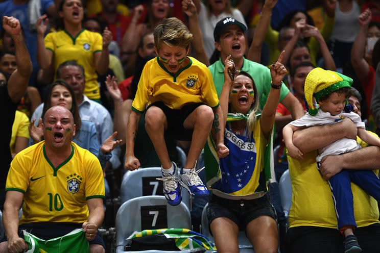 RIO DE JANEIRO, BRAZIL - AUGUST 17: Fans of Brazil cheer on their team during the Women's Quarterfinal match between China and Brazil on day 11 of the Rio 2106 Olympic Games at the Maracanazinho on August 17, 2016 in Rio de Janeiro, Brazil. (Photo by David Ramos/Getty Images)