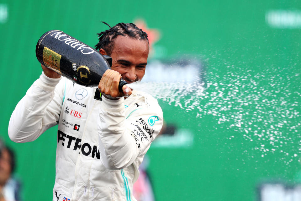 MEXICO CITY, MEXICO - OCTOBER 27: Race winner Lewis Hamilton of Great Britain and Mercedes GP celebrates on the podium during the F1 Grand Prix of Mexico at Autodromo Hermanos Rodriguez on October 27, 2019 in Mexico City, Mexico. (Photo by Mark Thompson/Getty Images)