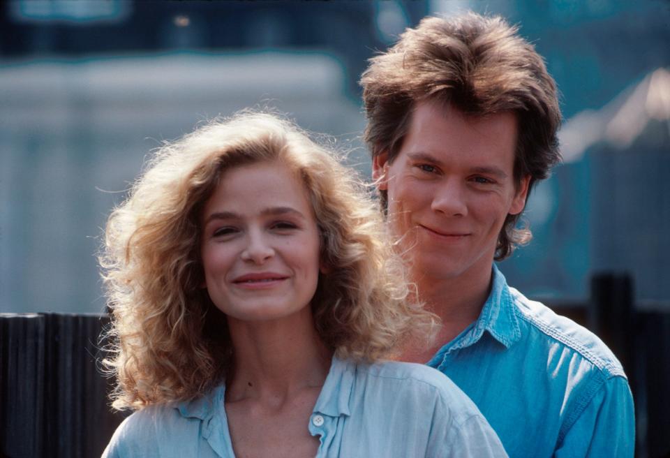 Kyra Sedgwick and Kevin Bacon standing next to each other
