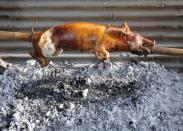 <p>At Christmastime, the most important food tradition in Puerto Rico is <em>lechon</em>, or roast suckling pig. It's <a href="https://www.tripsavvy.com/food-of-christmas-in-puerto-rico-1622186" rel="nofollow noopener" target="_blank" data-ylk="slk:a regional speciality;elm:context_link;itc:0;sec:content-canvas" class="link ">a regional speciality</a> that takes a very long time to prepare - in fact, it usually leads to a whole weekend gathering. The menu features other typical dishes, including <em>tembleque</em>, a coconut-based pudding; <em>pasteles</em>, a meat pastry similar to tamales made with green banana or plantain leaves; and <em>coquito</em>, which is the Puerto Rican version of eggnog, infused with coconut. </p>