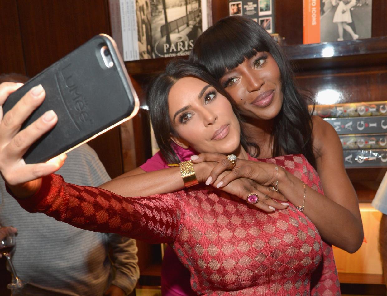 Kim Kardashian and model Naomi Campbell take a selfie: Getty Images for Taschen