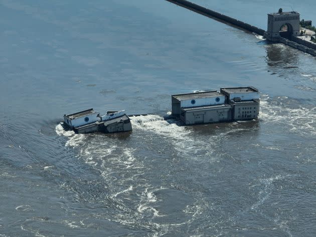 Water flows over the collapsed Kakhovka dam in Nova Kakhovka, in Russian-occupied Ukraine, Wednesday, June 7, 2023. 