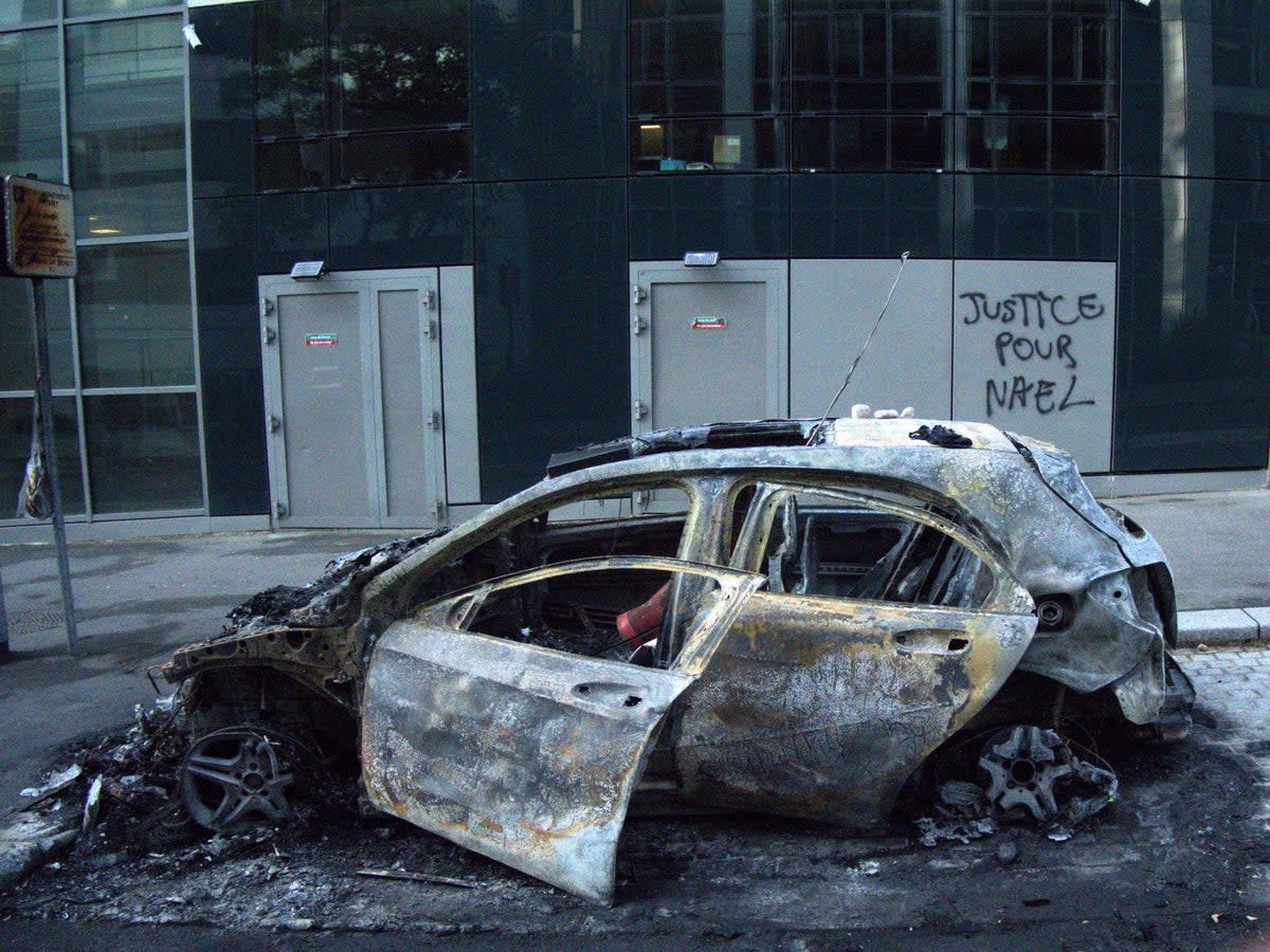 The remains of a car in the Paris suburb of Nanterre (Anthony Cuthbertson/The Independent)