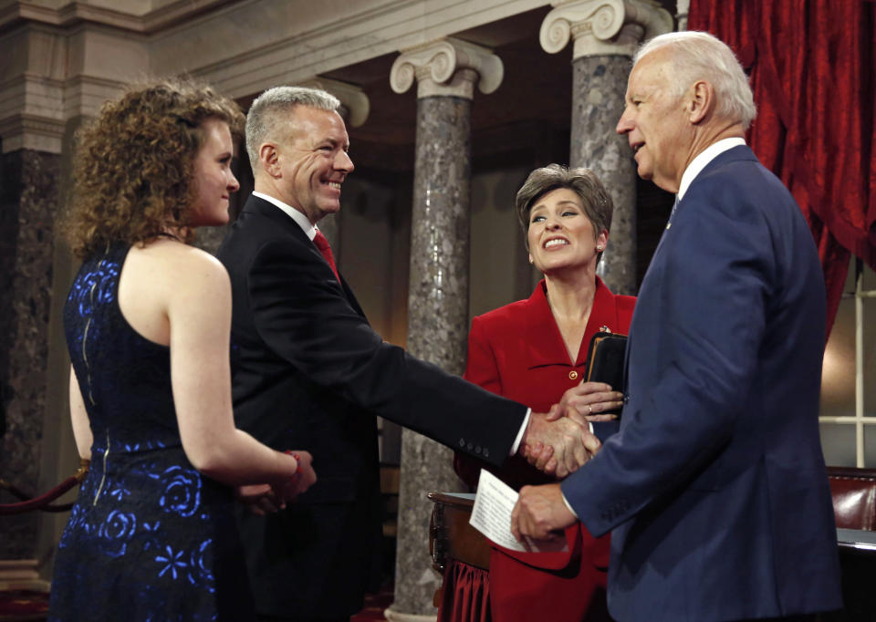 U.S. Senator Joni Ernst introduces her family before she is ceremonially sworn-in by VP Biden on Capitol Hill in Washington